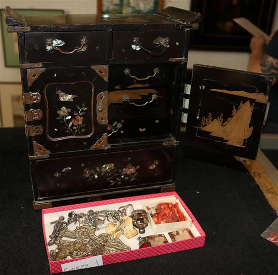 Japanese lacquered jewellery cabinet containing, coral, silver, albertina, other silver